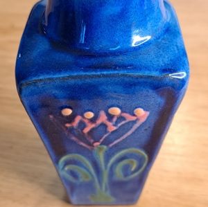 Earthworks decorated studio pottery vase